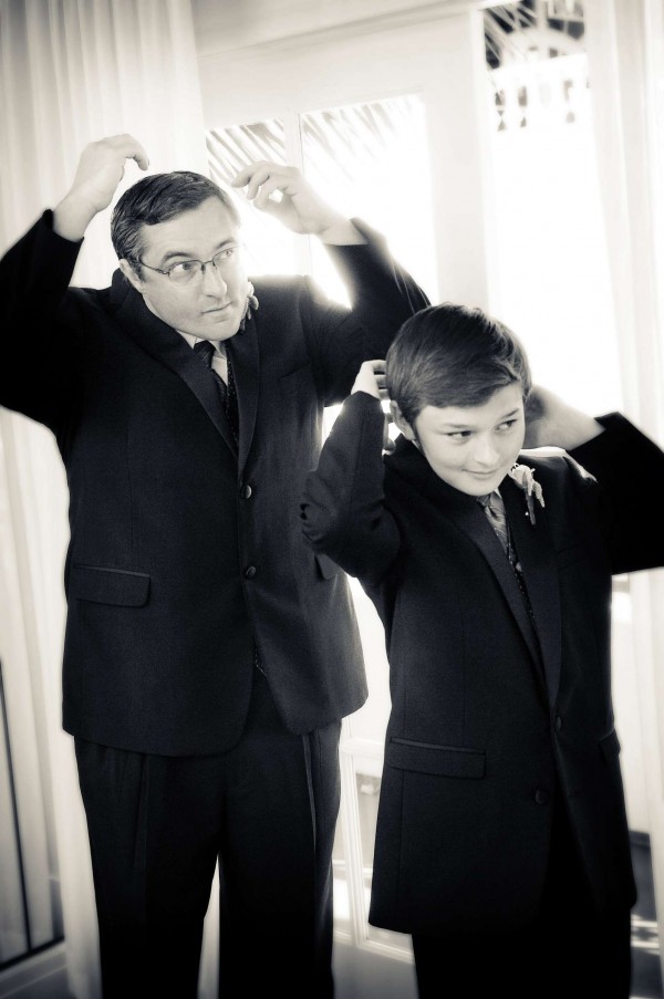 San Diego Wedding Photography: True Photography captures father and son looking in the mirror getting ready for wedding ceremony