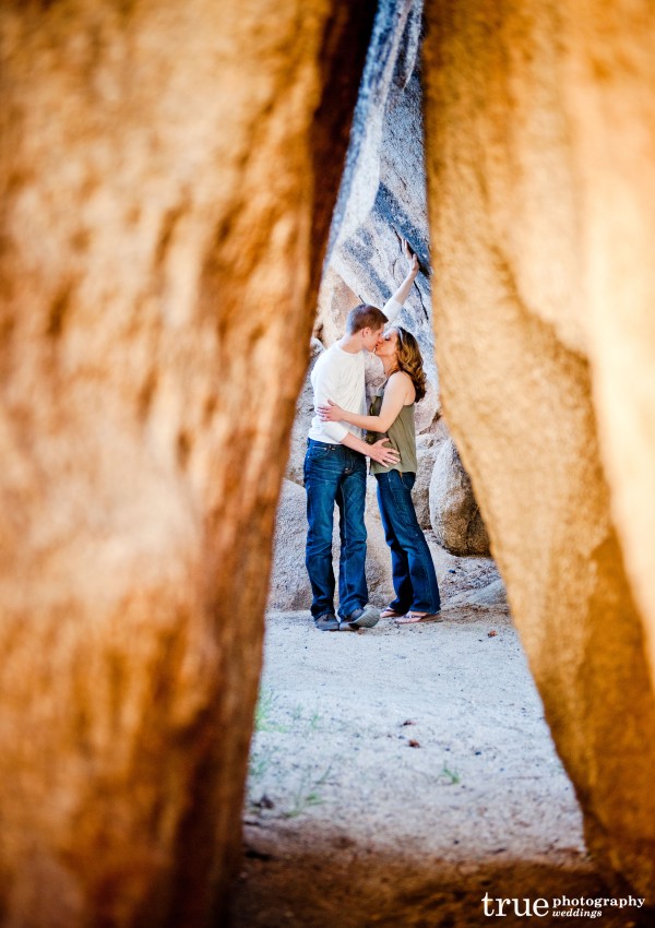 San Diego Wedding Photographer: Engaged couple photoshoot between rocks in Joshua Tree National Park in the desert;  desert wedding pictures