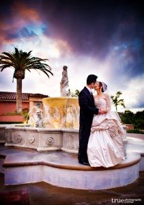 Grand-Del-Mar-wedding-bride-and-groom-on-fountain