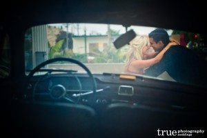 San Diego Wedding Photography: Engagement photo shoot on old classic car in Encinitas California