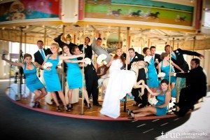 San Diego Wedding Photography: Bridal party riding the carousel at wedding in San Diego