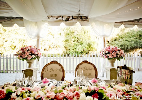 Wedding-with-flowers-on-sweatheart-table-by-The-Hidden-Garden