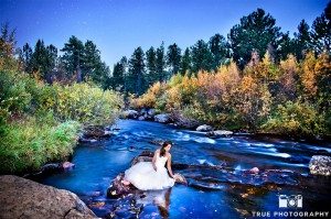 photo of bride at wild basin lodge in stream