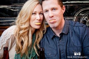 Little Italy Engagement shoot couple lemons after tequila shot