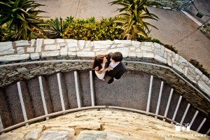 Engagement shoot of Del Mar Beach couple overhead on staircase