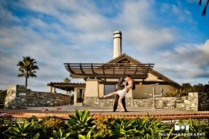 Engagement shoot of Del Mar Beach couple in front of building