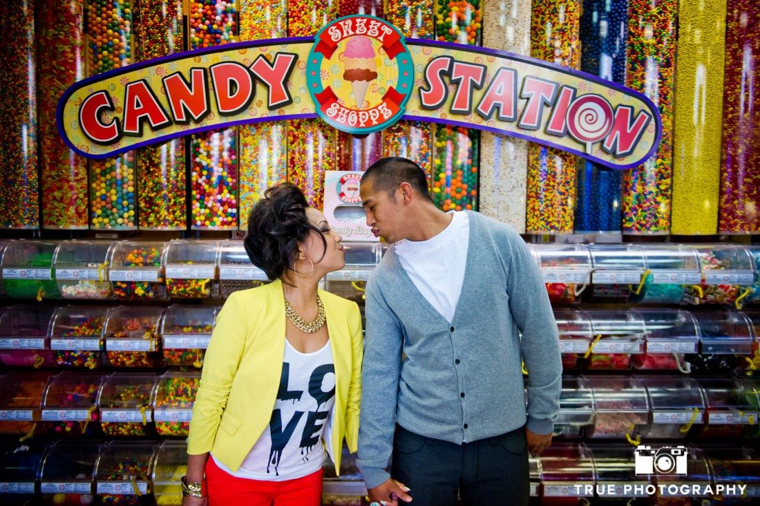 Engagement photo shoot of Mission Beach couple in candy shop