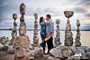 couple standing near rocks at Seaport Village Engagement Photo Shoot