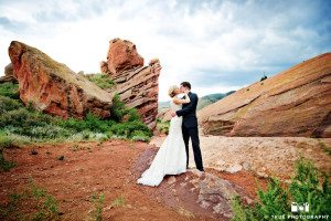 Bride and Groom lean in for kiss on mountain in Colorado