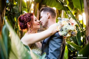 Couple kiss in tropical garden