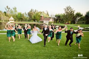 Fun Bridal Party running up hill