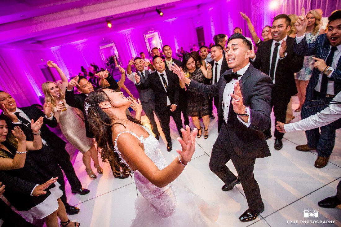 Action photograph of the bride and groom dancing the night away with their guests at the SLS Hotel in Beverly Hills