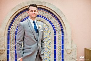 Groom standing in front of textile wall at La Valencia