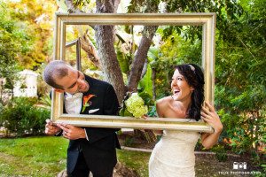 Couple make funny faces while holding vintage frames