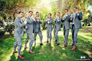 Groomsmen pose for fun photo at Green Gables Wedding Estate to show off cool socks