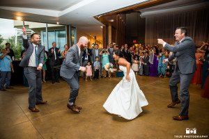 Bride and groom dancing at Scripps Seaside Forum