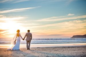 Bride and groom during sunset at Coronado beach