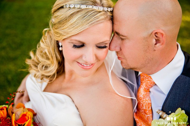 Close-up portrait of bride and groom at winery
