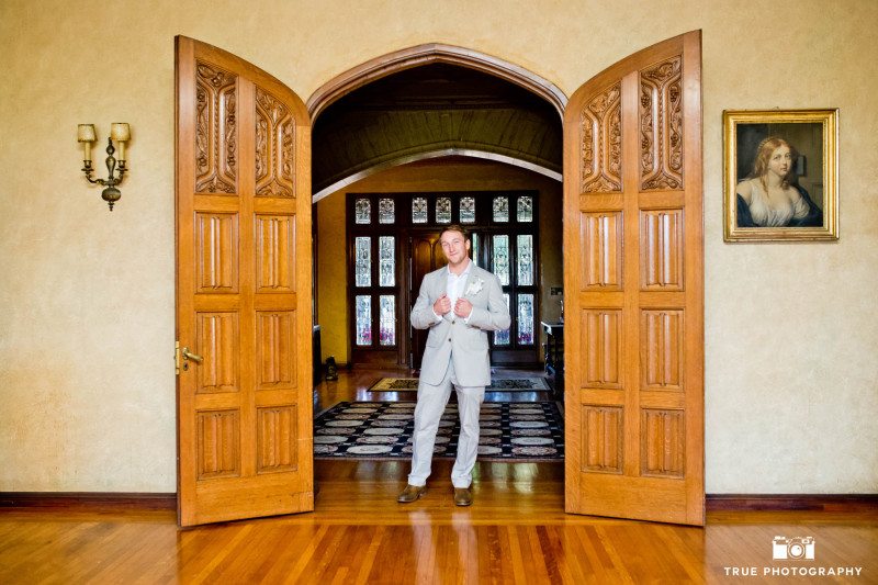 Grand Historical Mansion portrait of groom inside archway