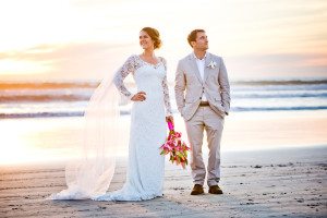 Bride's gown by D'Angelo couture and groom looking dapper on Coronado beach