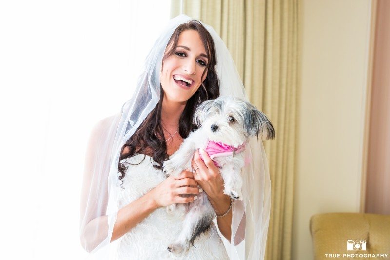 Bride holding her terrier