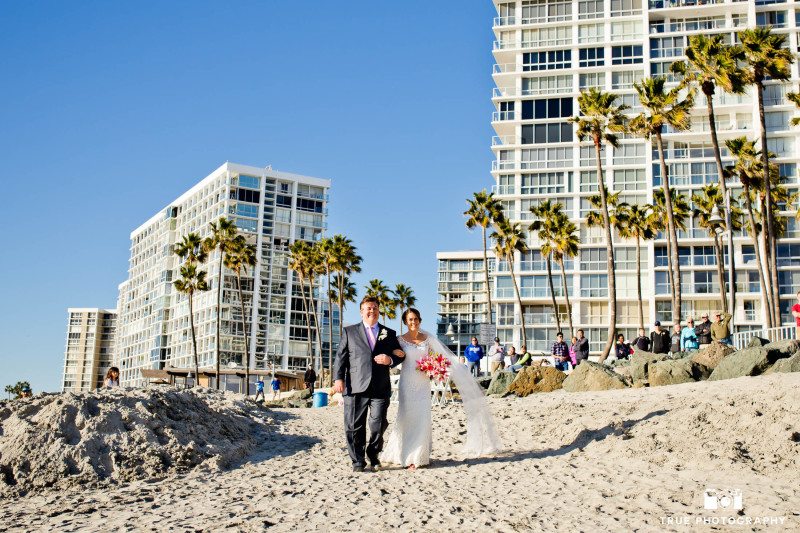 Coronado wedding ceremony with bride and father walking the processional