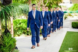 Groom and groomsmen walking to the wedding ceremony at The Hilton San Diego Bayfront