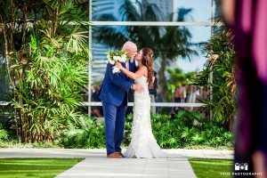 San Diego Hilton Bayfront wedding with bride kissing father