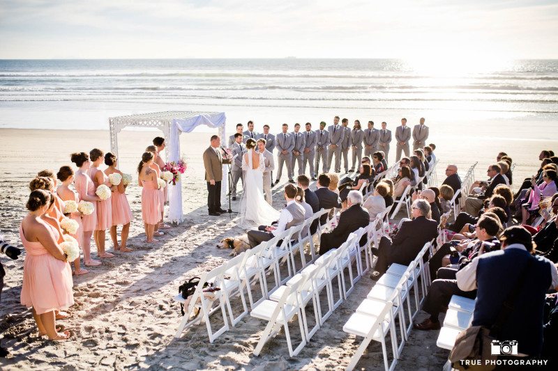 Coronado beach wedding ceremony with large bridal party and guest
