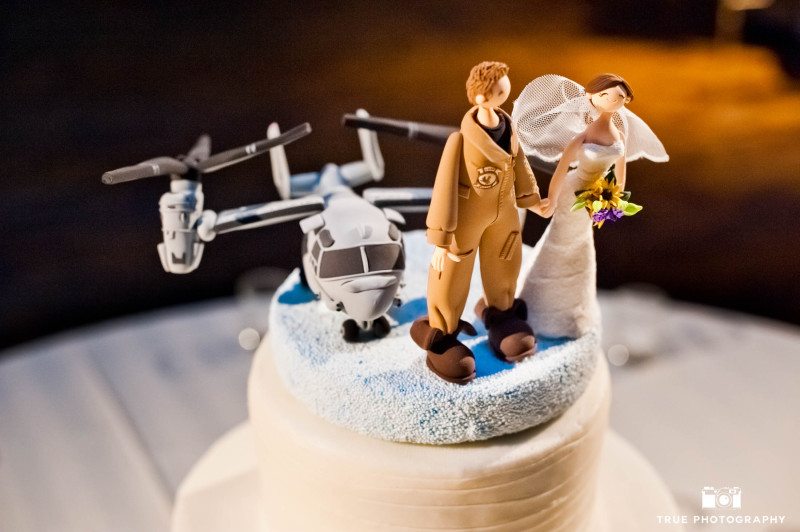Creative navy-themed cake topper with wedding couple