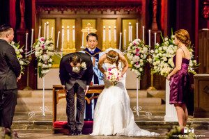 First Congregational Church of Los Angeles wedding with couple bowing