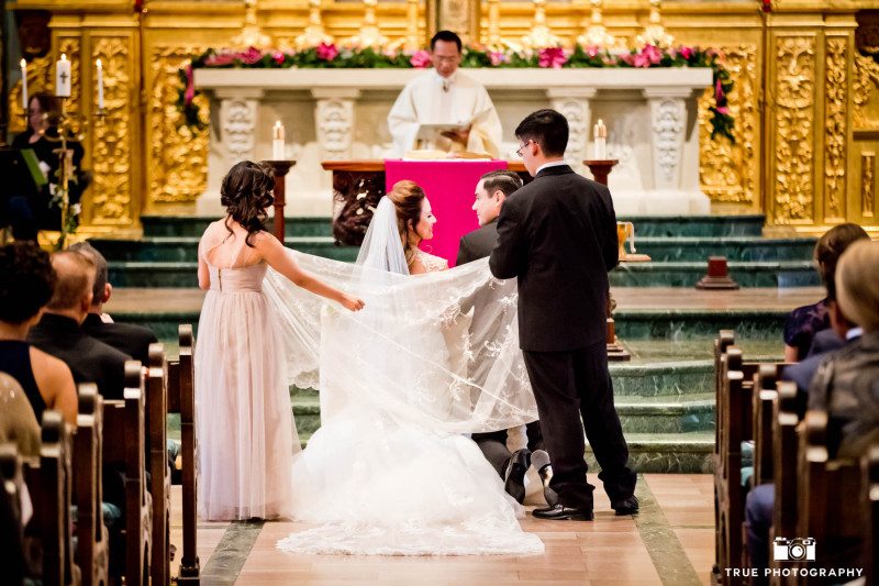 This Catholic wedding incorporates tradition during their USD ceremony.
