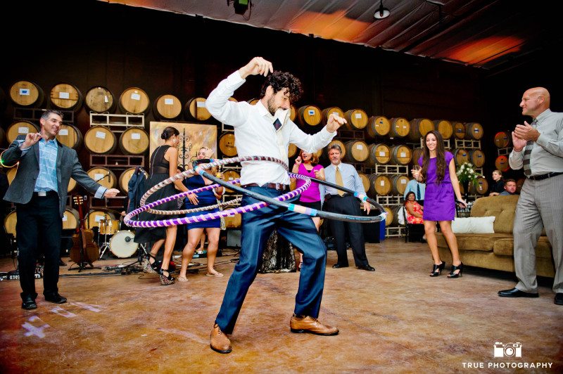 Guest hula-hoops during wedding reception