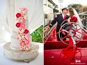 Couple with firetruck and white with red flowers wedding cake
