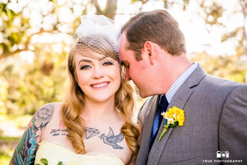 Bride and Groom touch foreheads in Balboa Park