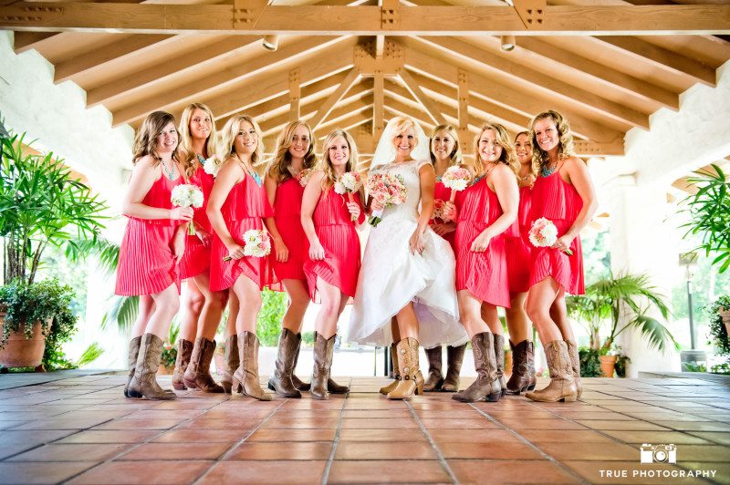 Bridesmaids and Bride show off fun rustic cowboy boots