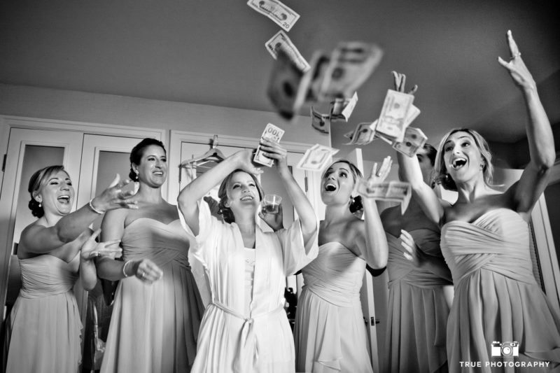 Bridesmaids make it rain as they toss money in the air before wedding ceremony