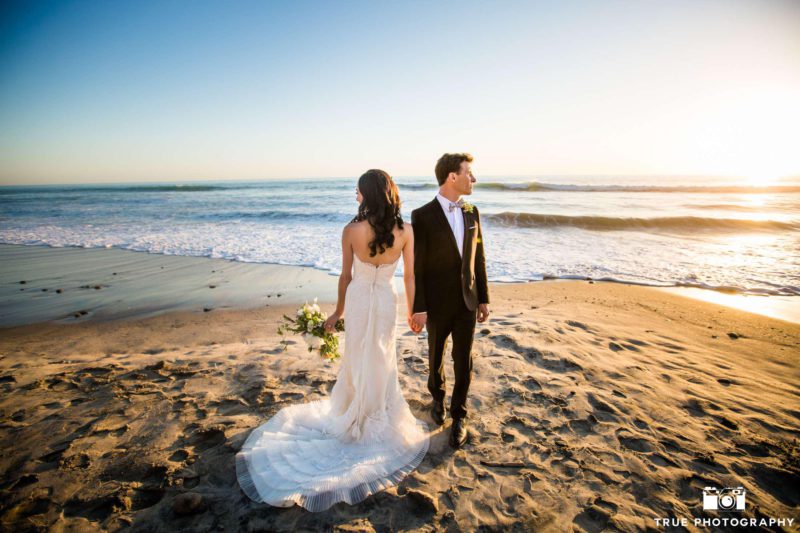 Cape Rey Carlsbad wedding couple on the beach during sunset