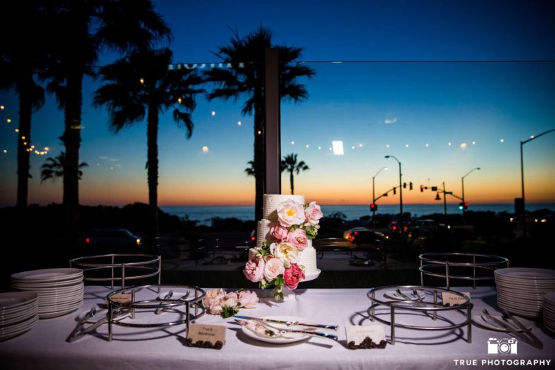 Cape Rey Carlsbad a Hilton Resort wedding cake during sunset