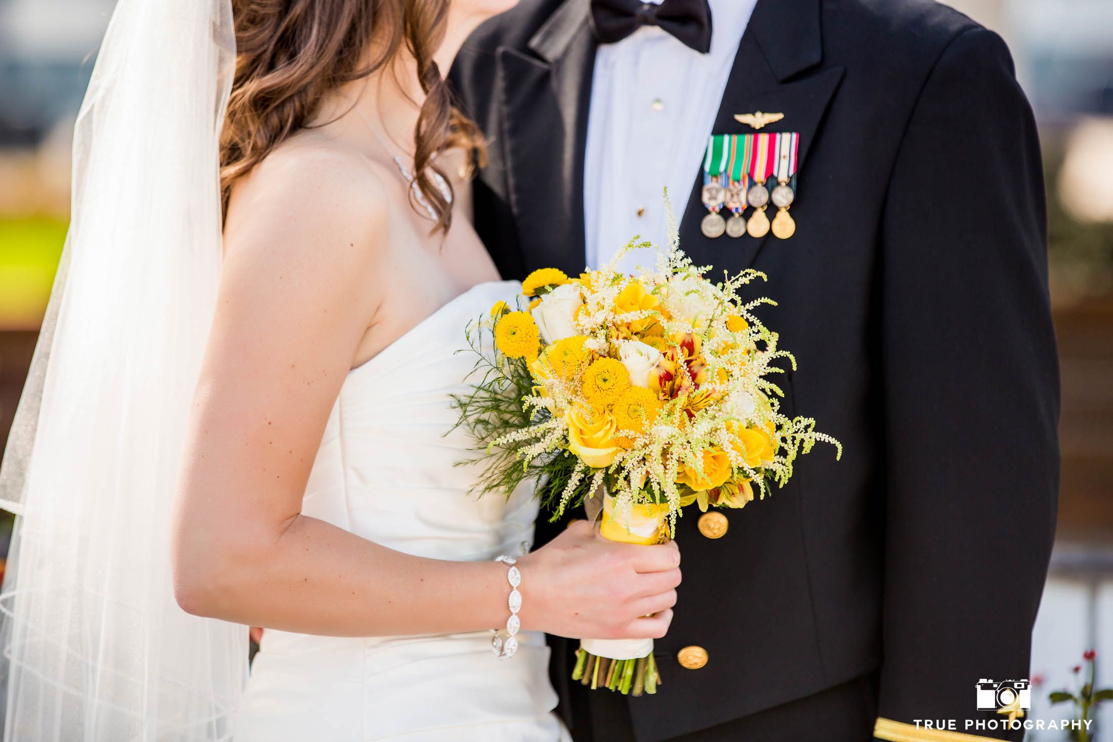 Close-up of military bride's yellow bouquet