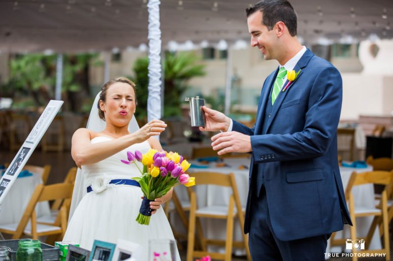Bride having a swig from a flask