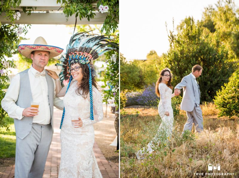 Wedding Couple with fun photobooth props and walking through grassy field during sunset at wedding reception at spanish-style ranch