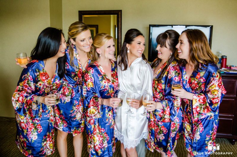 Bridesmaids in Robes Celebrate with Champagne Toast