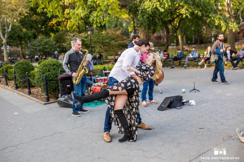 Engaged Couple dance to live music in Washington Square Park in New York City.