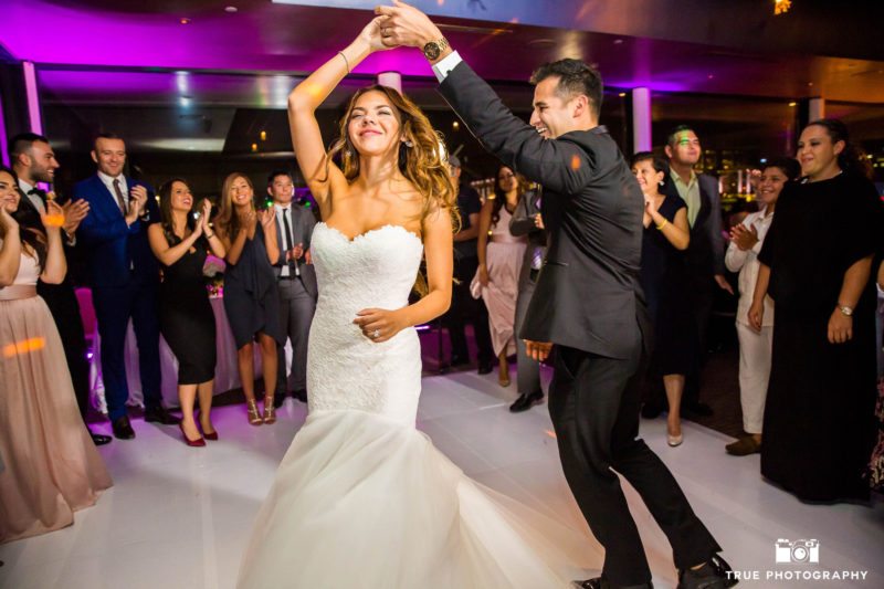 Guests cheer on as Bride and Groom celebrate their First Dance