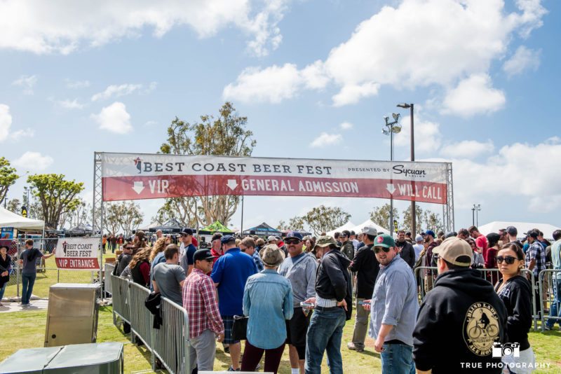 People wait in line at entrance for the Best Coast Beer Fest at Embarcadero Park in San Diego, California