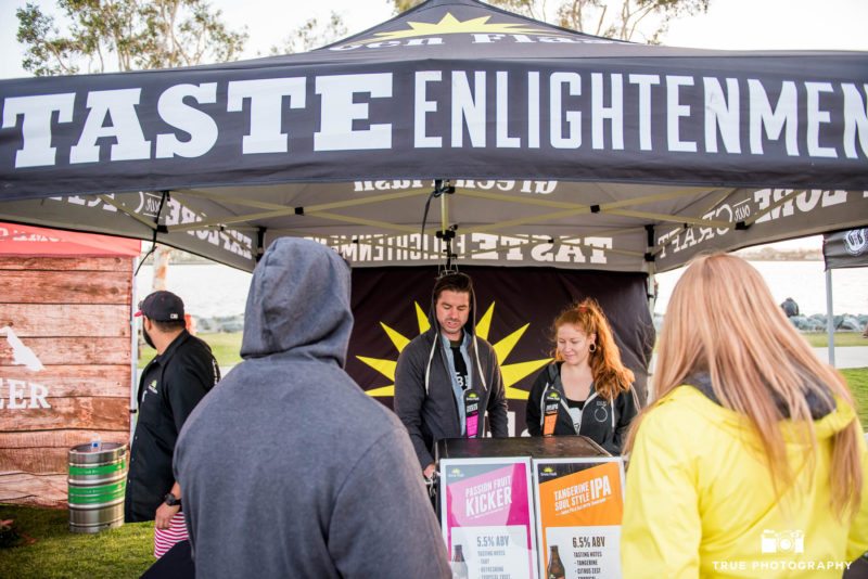 Greenflash Brewing Company hands out beer tasters to eventgoers at craft beer festival in Downtown San Diego