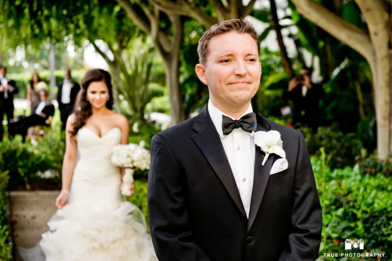 Groom anxiously waits to see his bride for the first time