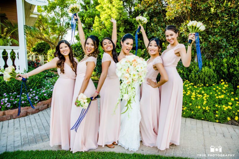 Bride and her bridesmaid celebrate and show their excitement