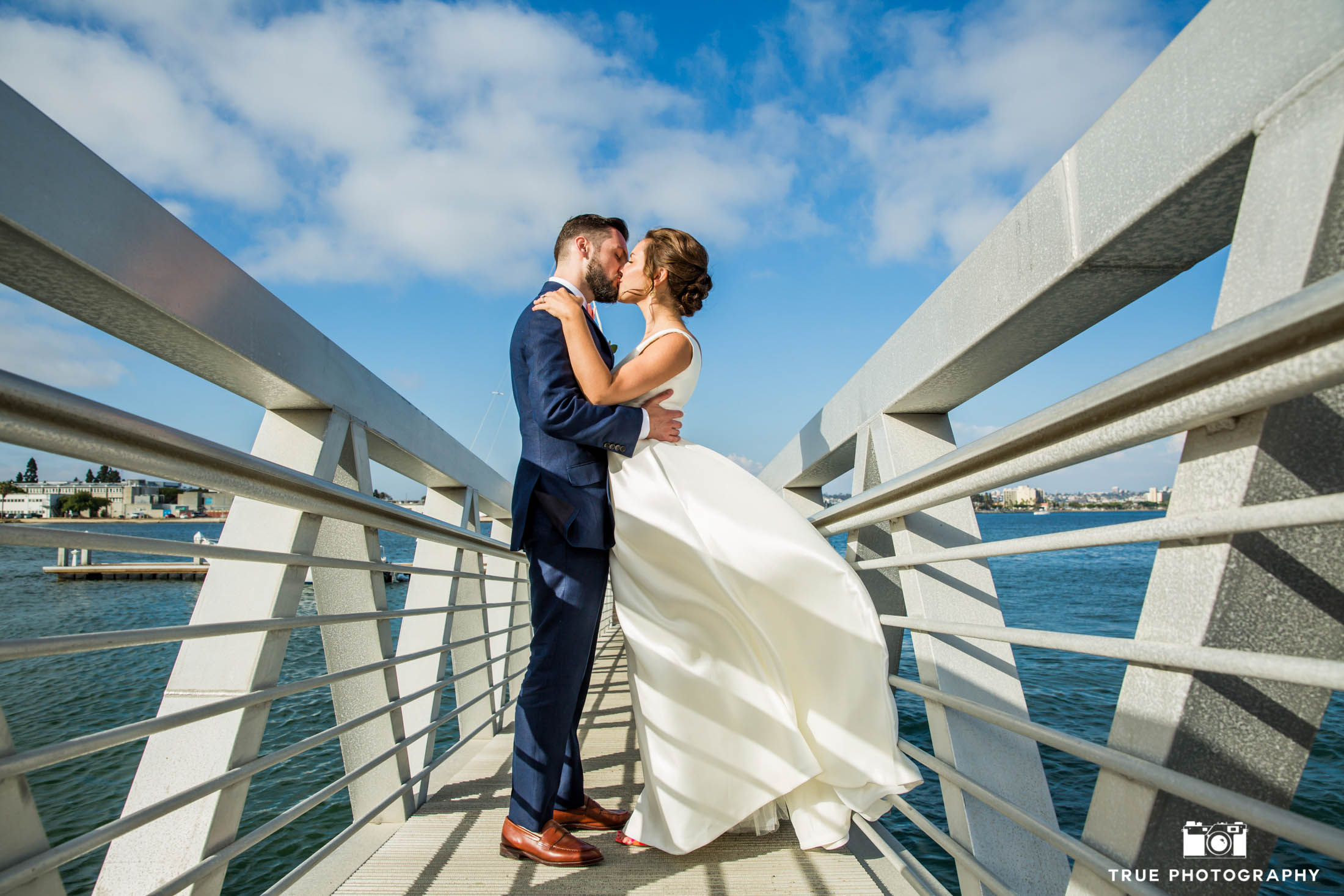 Wedding kiss on a dock